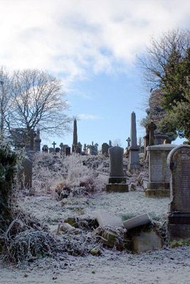 gravestones covered in frost in a Scottish cemetery